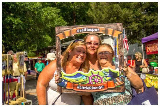 Ladies pose for photo at Blue Crab Festival Little River, SC