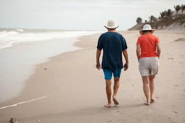 snowbird visitors walking the beach