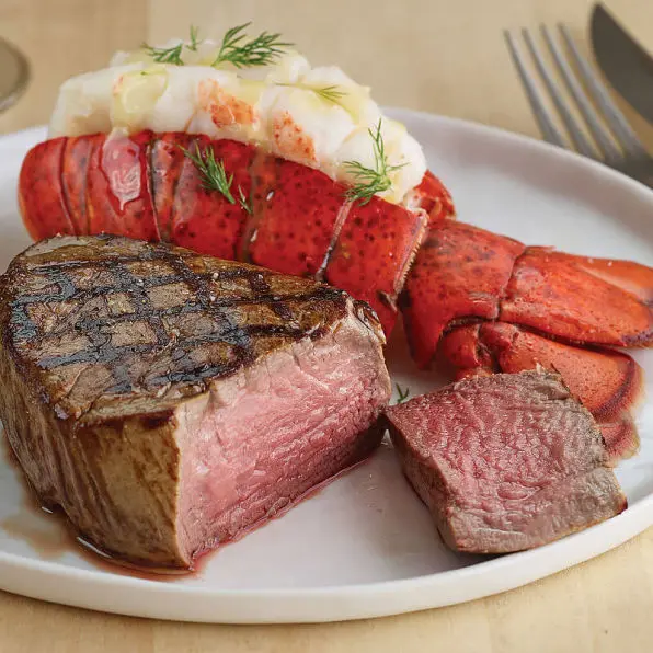 a plate of steak and lobster