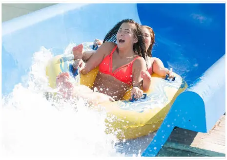 Girls ride a raft at Wild water and wheels water park in Myrtle Beach, SC
